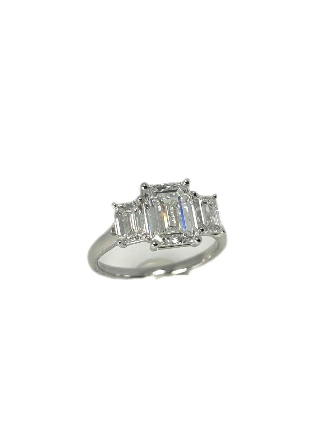 Lab diamond 3.07ct emerald cut trilogy ring