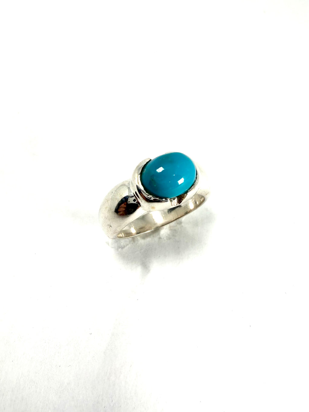 Silver ring with blue gemstone