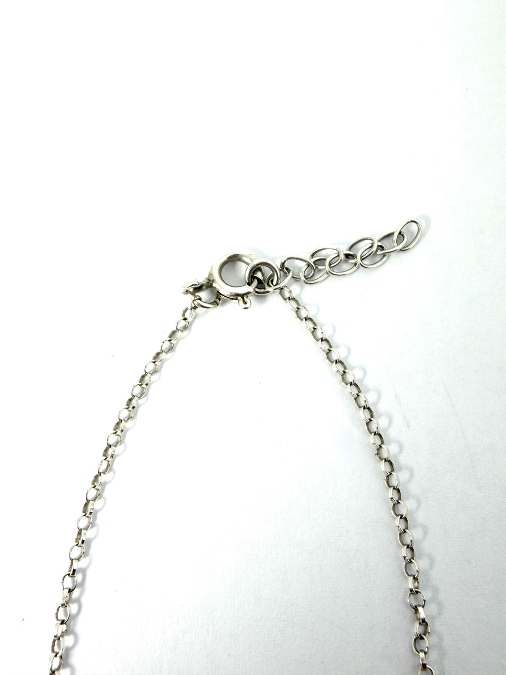 Silver infinity bracelet with green gemstone