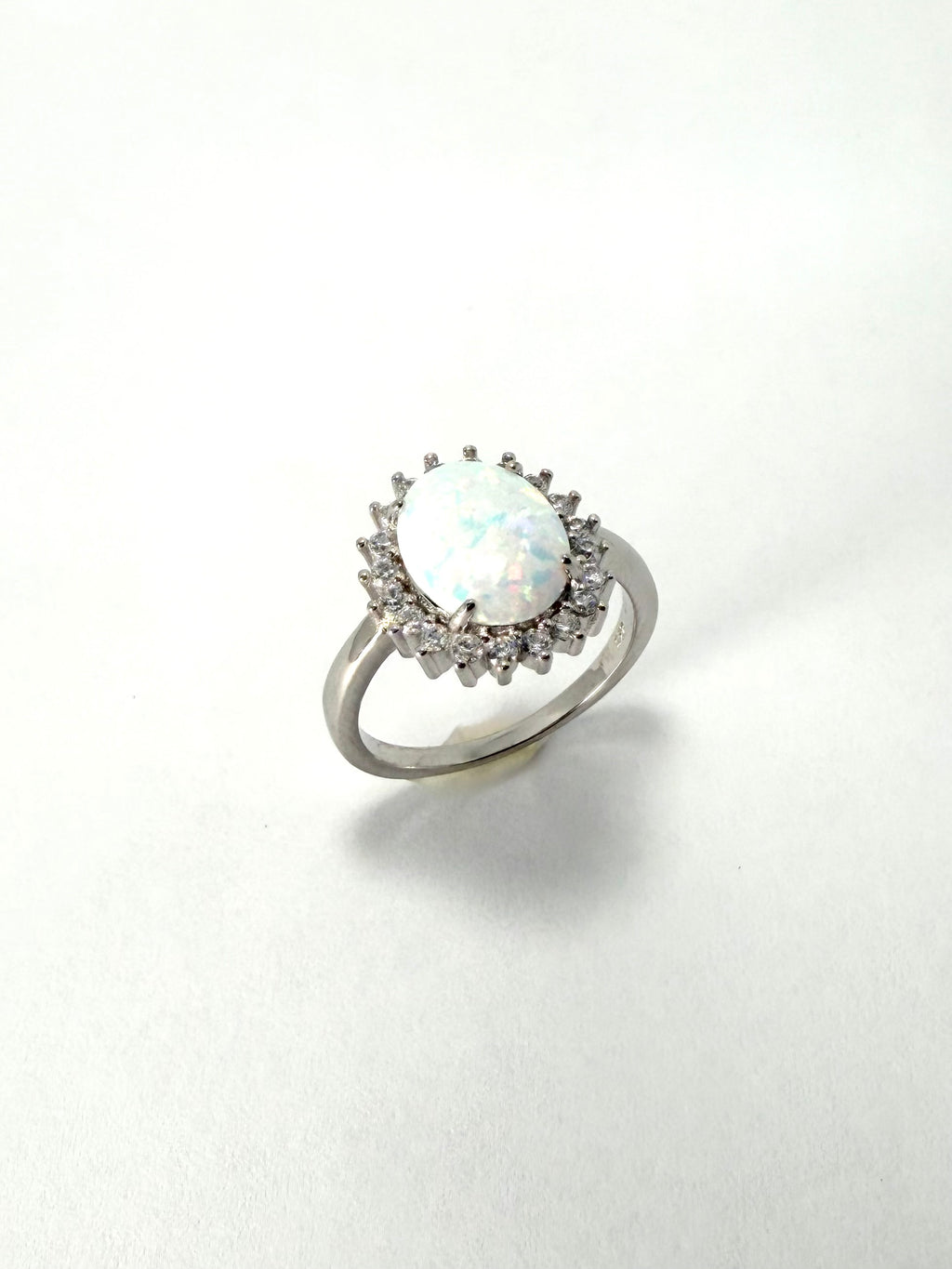 Silver synthetic oval opal cubic zirconia cluster ring