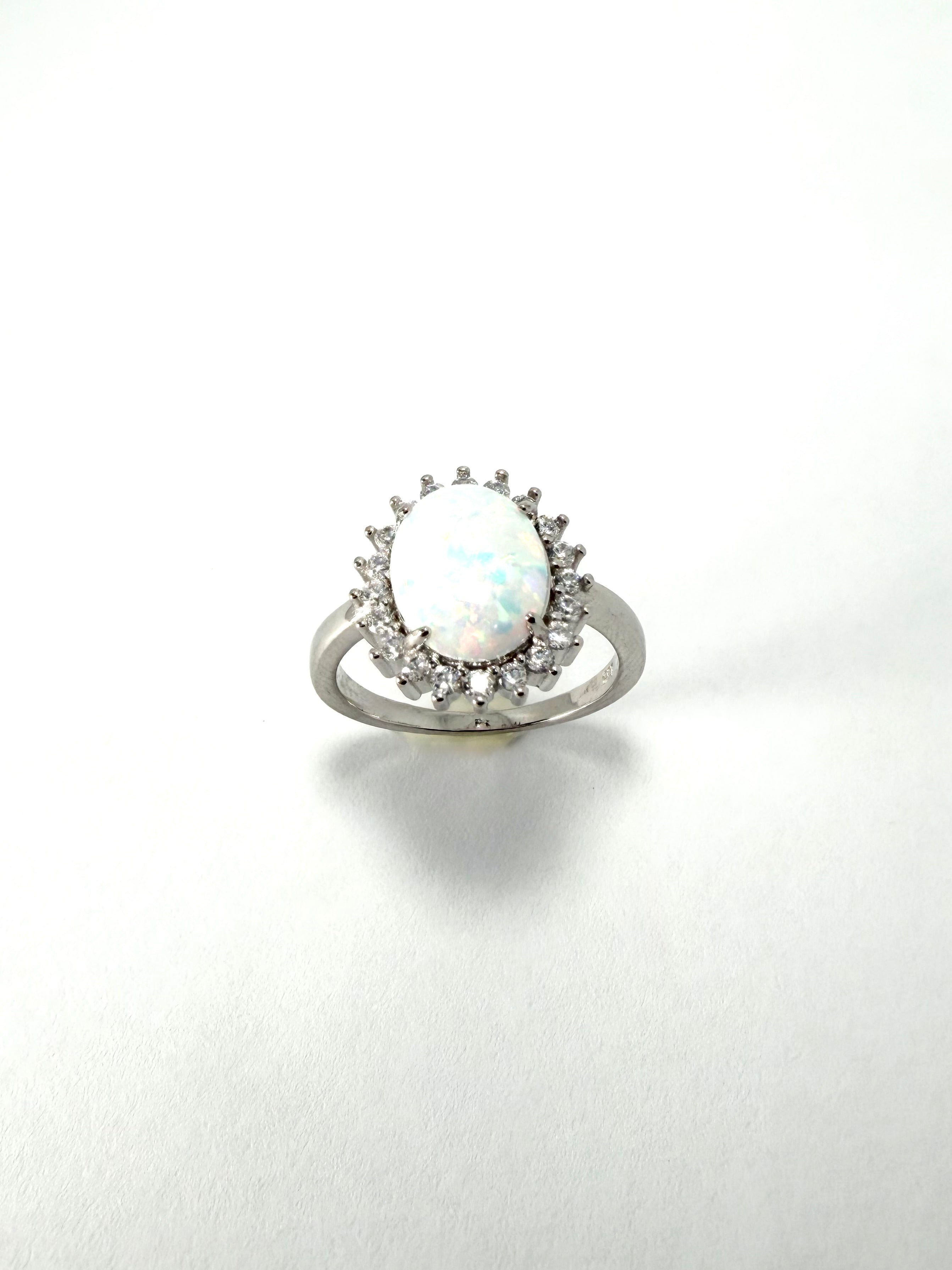 Silver synthetic oval opal cubic zirconia cluster ring