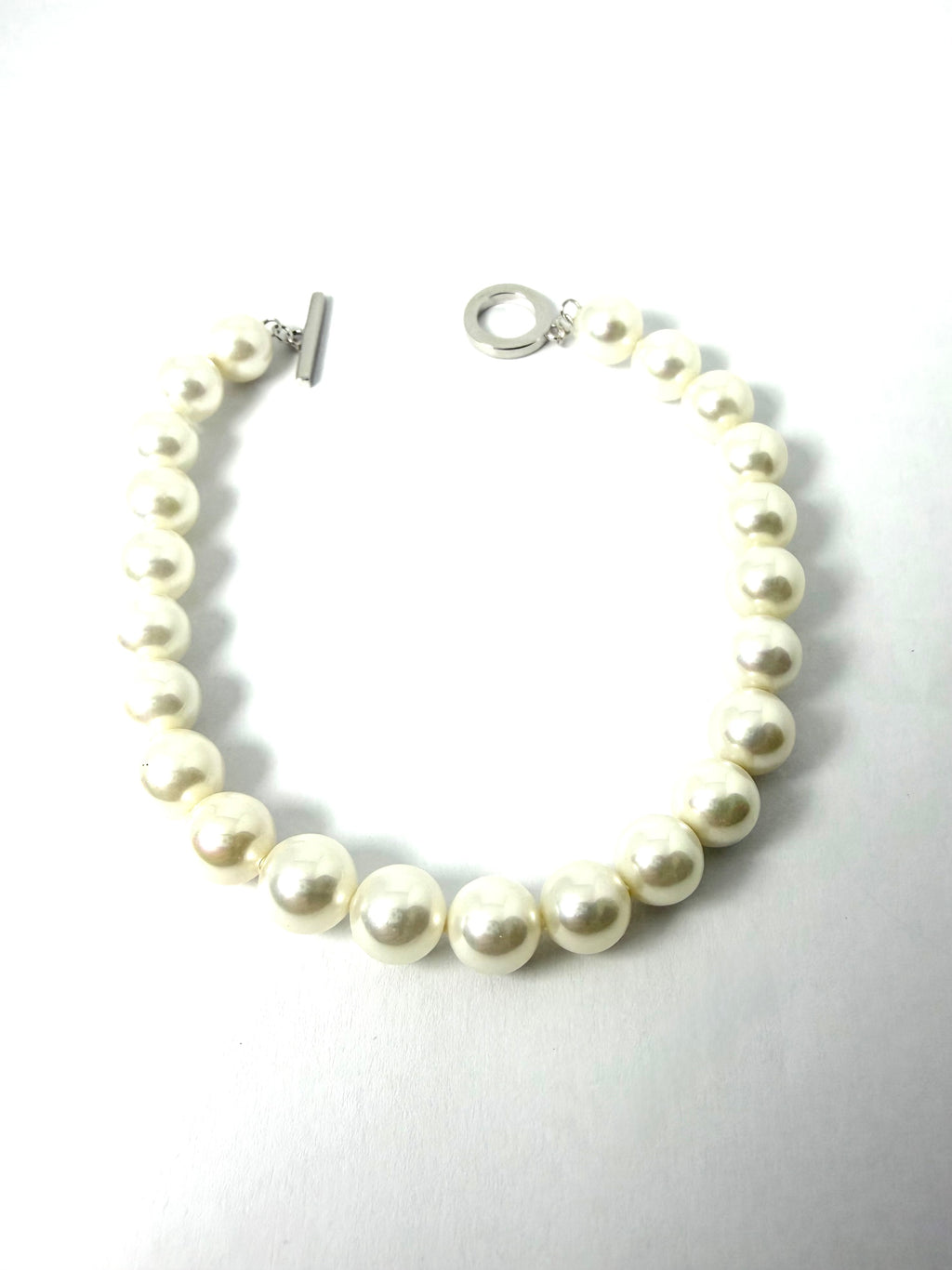 Silver and synthetic pearl bracelet