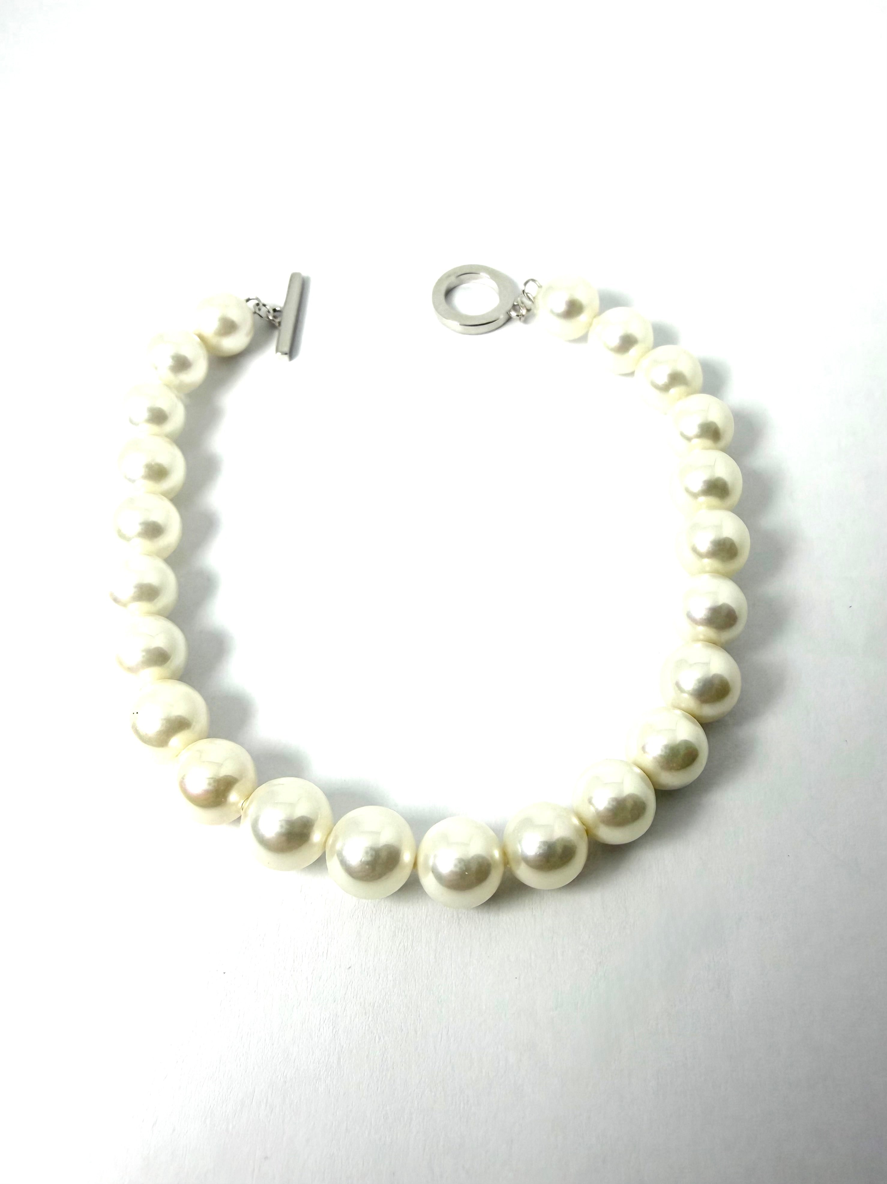 Silver and synthetic pearl bracelet