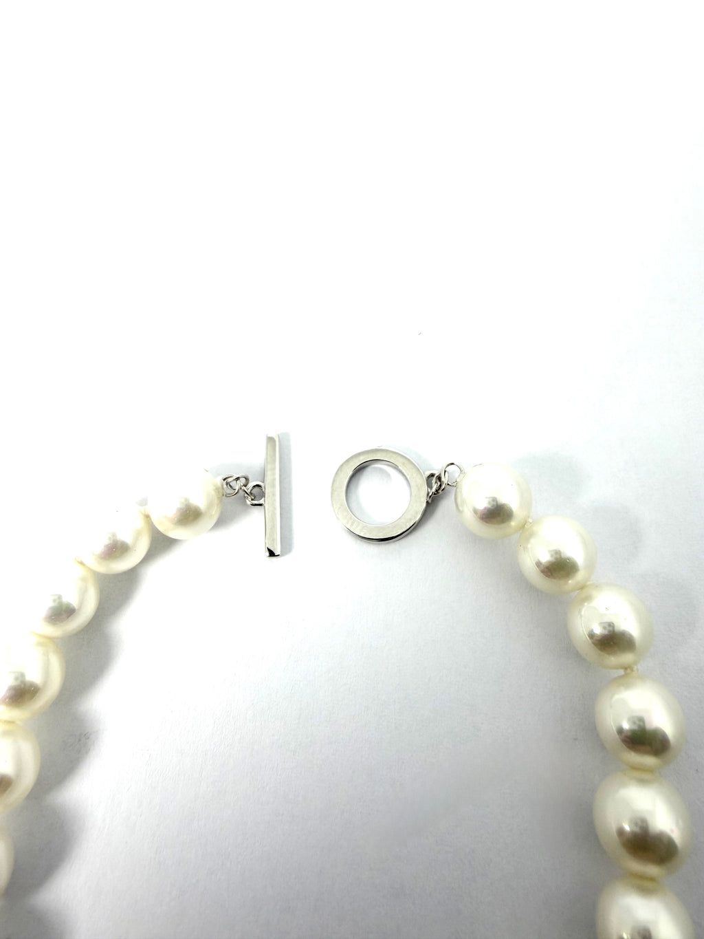 Silver and synthetic pearl bracelet
